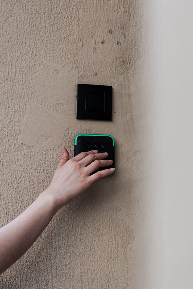 A guest using the room access reader at RAIBU