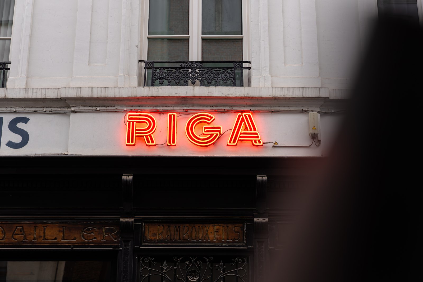 The illuminated Hotel Riga sign in Antwerp